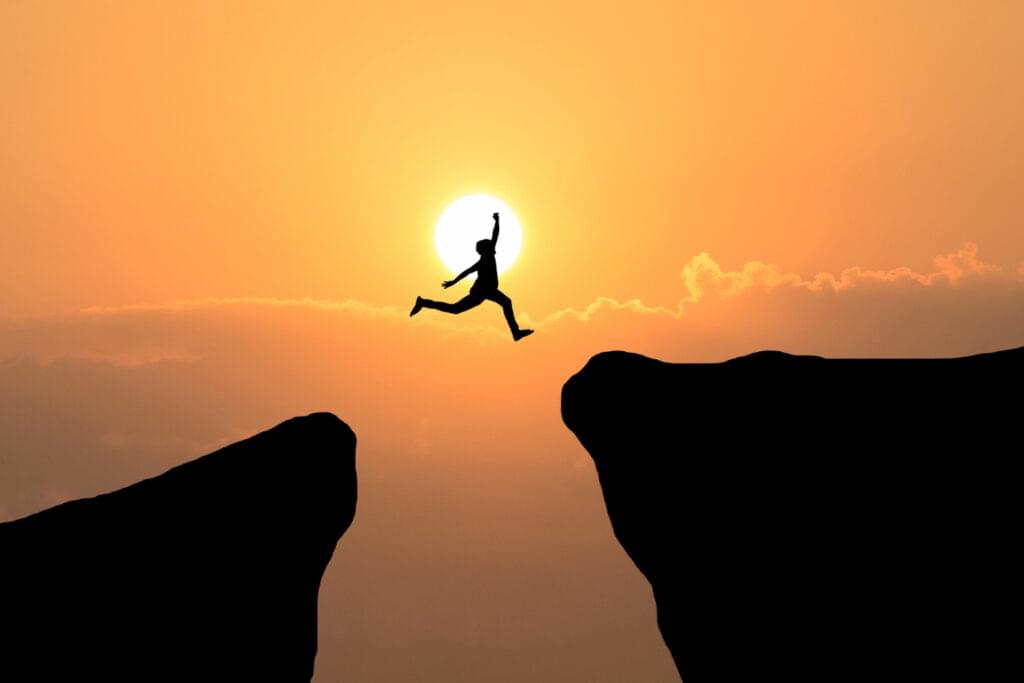 courage man jump through gap hill business concept idea 1024x683 1